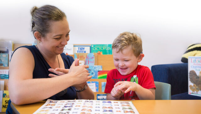 Adult and child signing