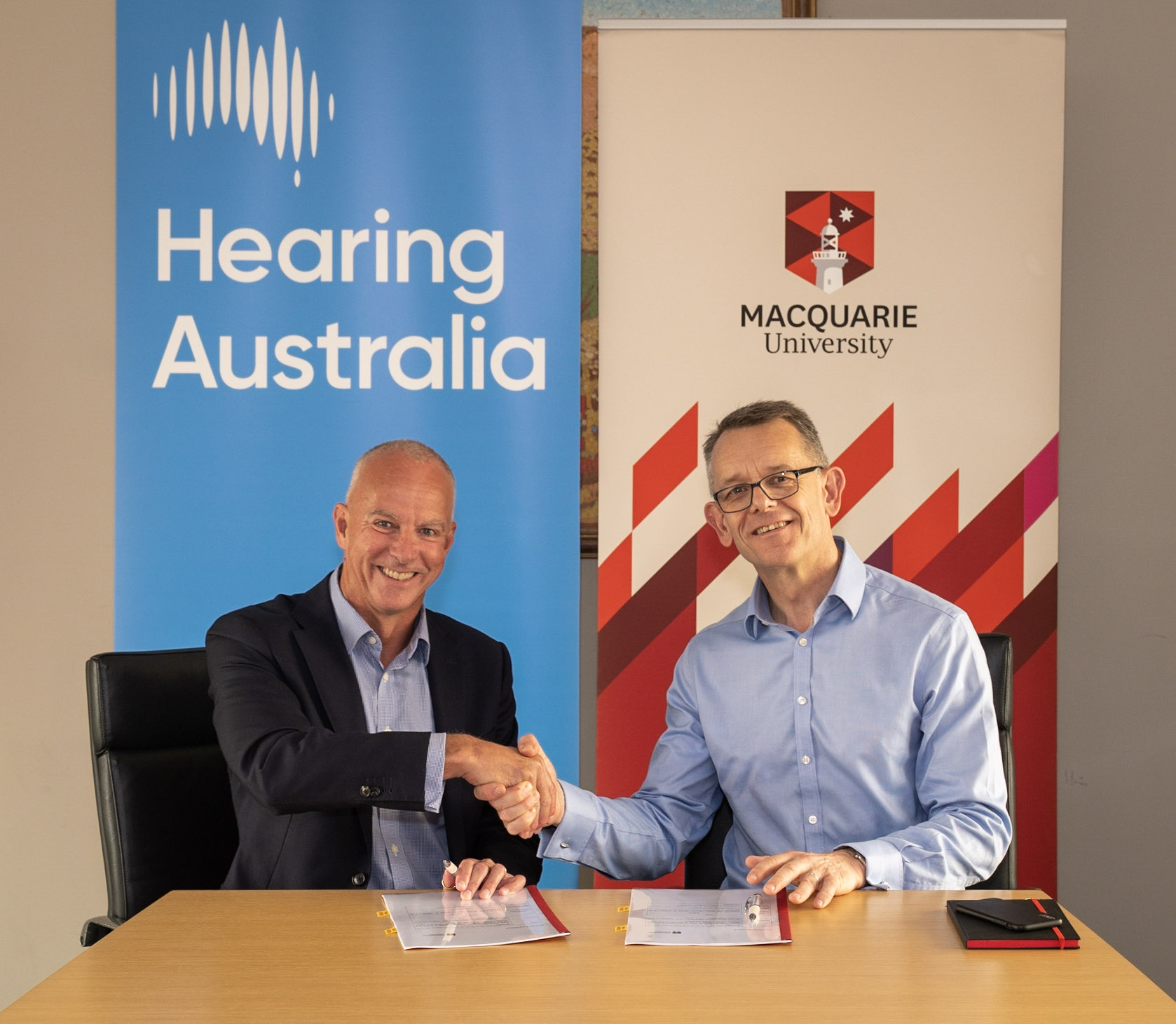 Hearing Aust Mac Uni Agreement Signing