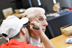 An older person getting a hearing test