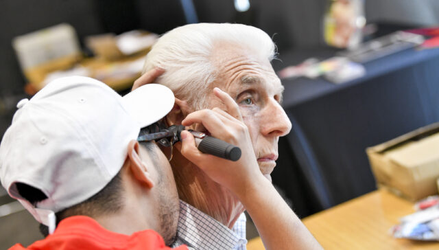 An older person getting a hearing test